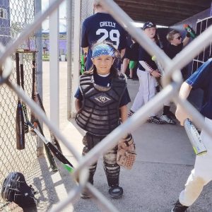 child in baseball gear