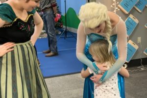 Elsa hugging child
