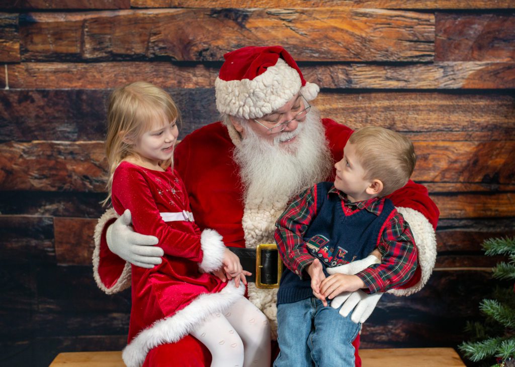Santa and two children at Cookies with Santa