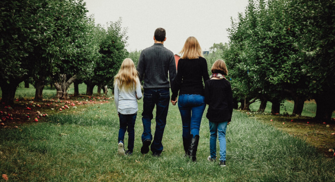 2 children and 2 parents walking in an orchard, would i marry my husband again