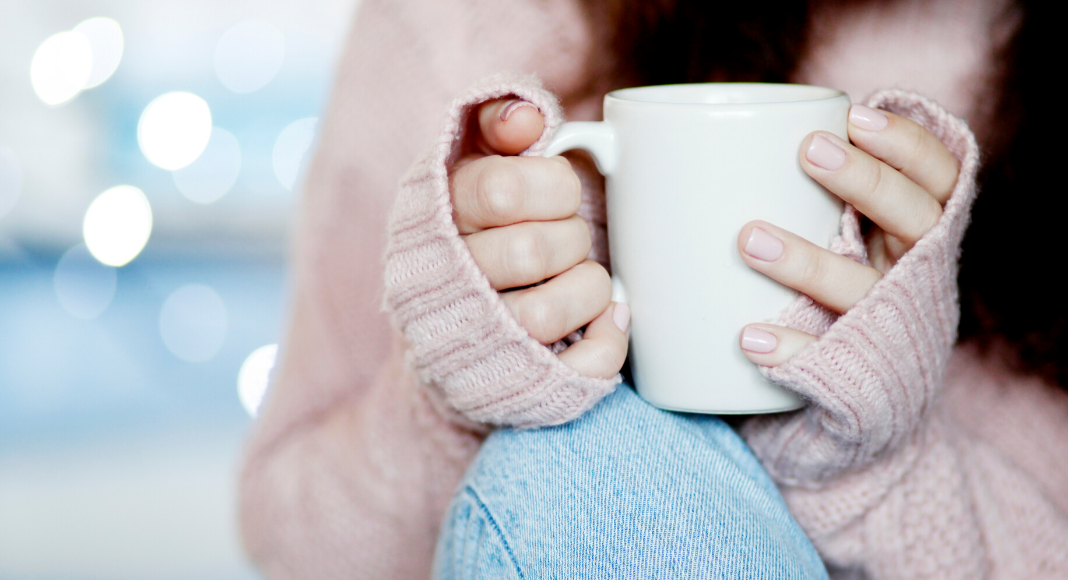 self-care in a crisis, woman holding coffee cup
