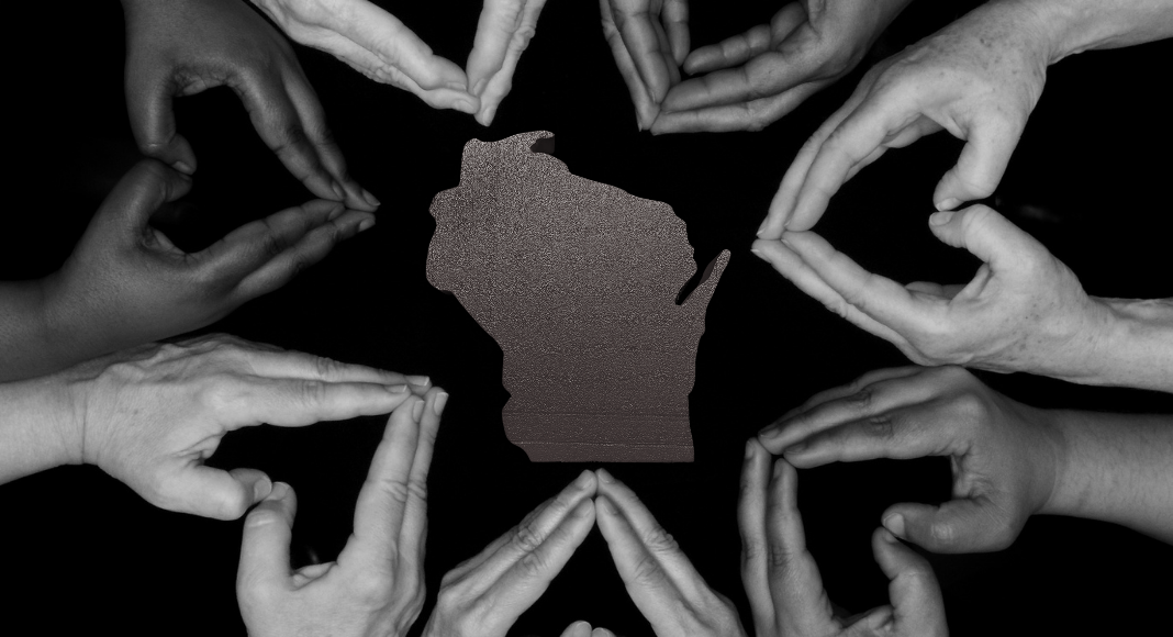 Women Making History in WI; hands making hearts around the state of WI