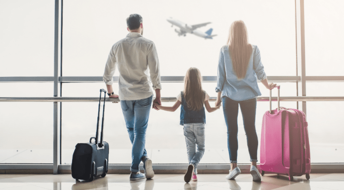 summer travel tips, family at airport