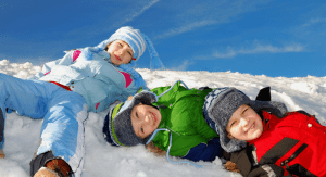 2022 Family Winter Activity Guide; kids in snow